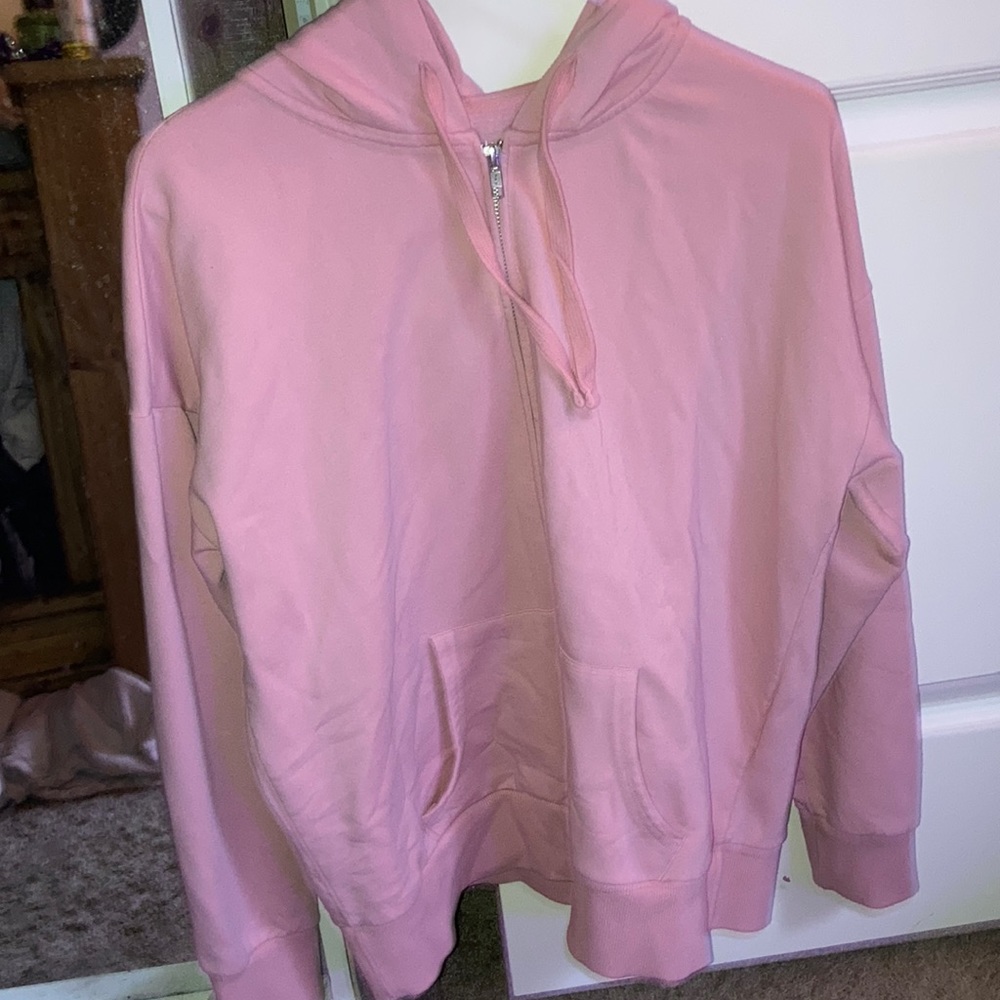 Pink zip up from “time and tru”